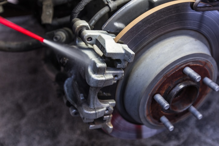 Cleaning car brake pad and disc with caliper