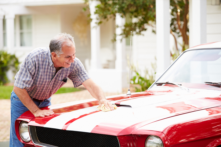 Retired Senior Man Cleaning Restored Car. Polishing Bonnet, Smiling