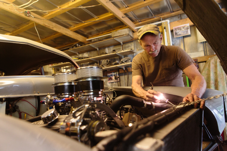 Mechanic working in garage shop