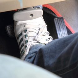 Man using his brake pedal whilst driving