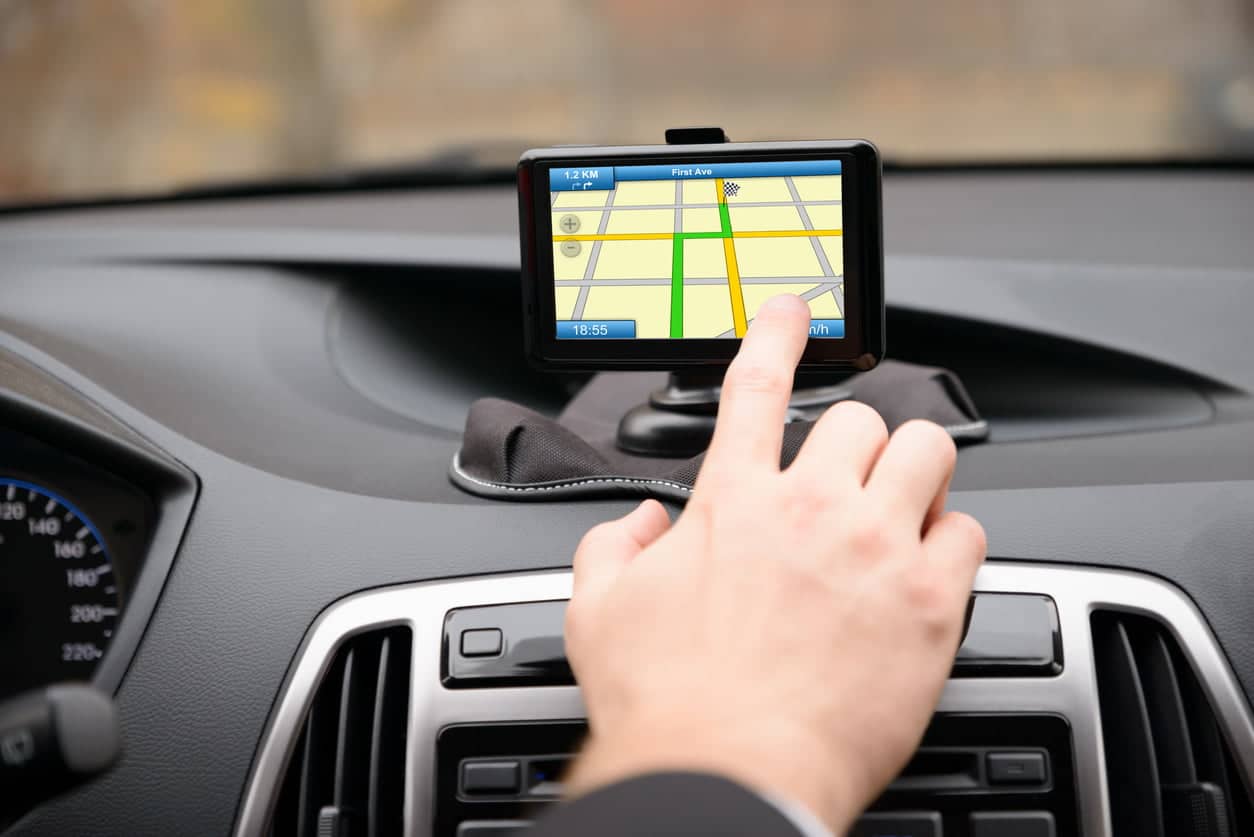 Man Using Gps Navigation While Driving