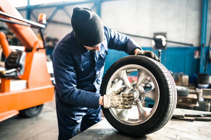 tire repairer checking the tire integrity