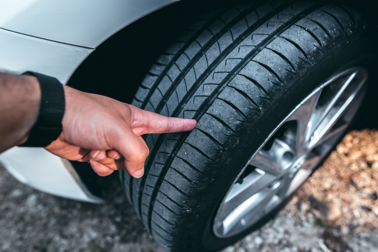 Man checking his tyre