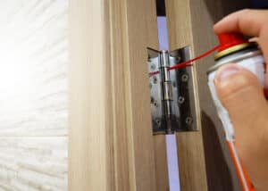 lubricating a door hinge