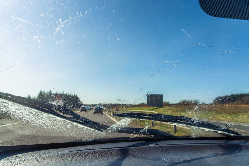 cleaning the windscreen whilst driving