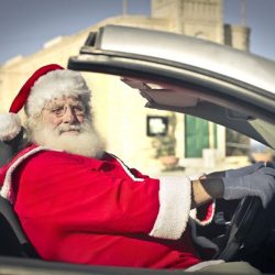 Santa Claus driving a car