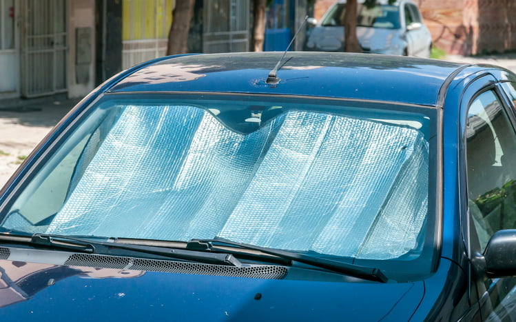 Sunlight reflectors on the windscreen to protect the car's plastic
