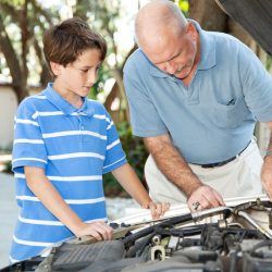 Healthy Routine for Your Car - father and son checking car