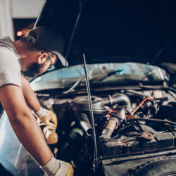 mechanic working on classic car