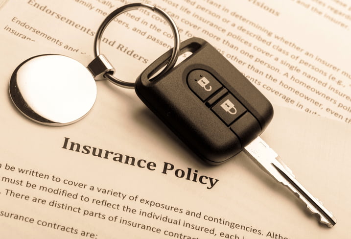 Car Key on an Insurance Policy Document 