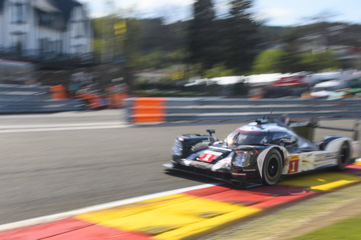 Spa, Belgium - May 7, 2016: Porsche 919 Hybrid sports-prototype racing car in Eau Rouge during the 2016 FIA WEC 6 Hours of Spa. The car is driving around the Spa Francorchamps race track during the WEC 6 Hours of Spa-Francorchamps. The team participates in the 2016 FIA World Endurance Championship (WEC).
