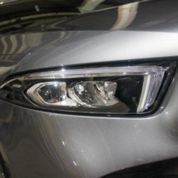 Close Up of a Silver Car Headlights