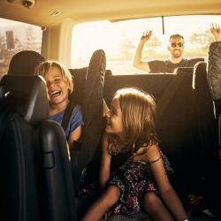 image of happy family in car