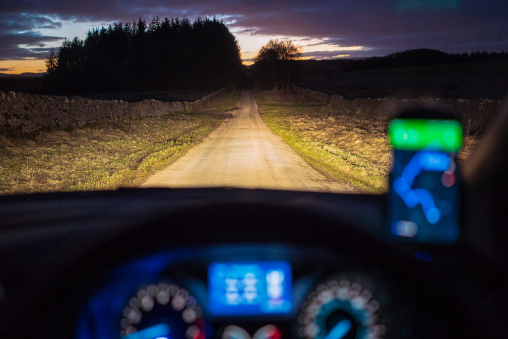 Driving in a country lane at dusk