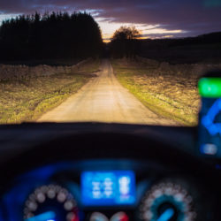 Driving in a country lane at dusk