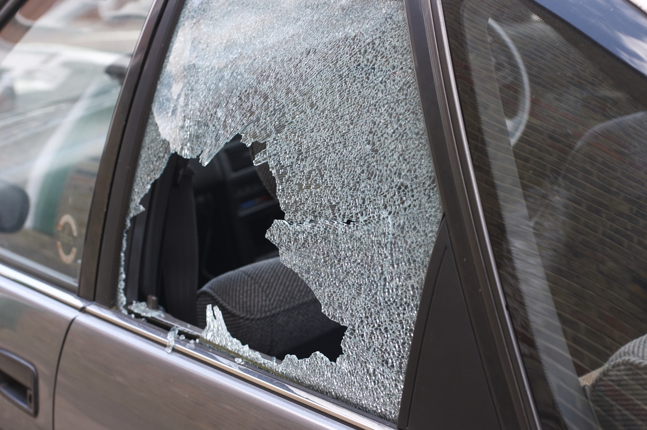 Thief broken glass in car window