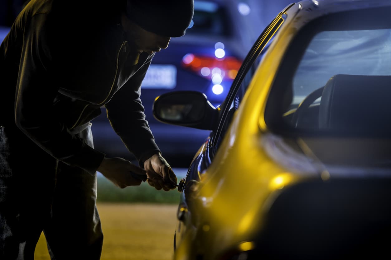 Car thief stealing a car