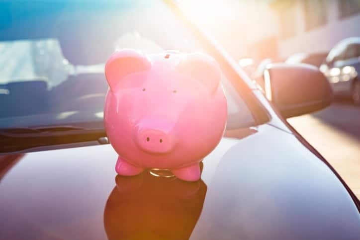 Close-up of a piggybank on new car