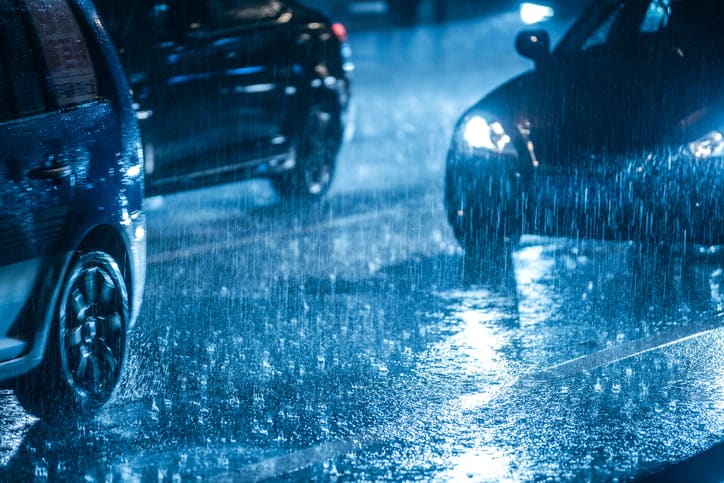 Cars Driving In The Rain.