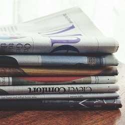 stack of newspapers for press