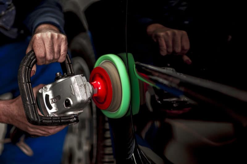Polishing a car segment using an electric orbital polisher.