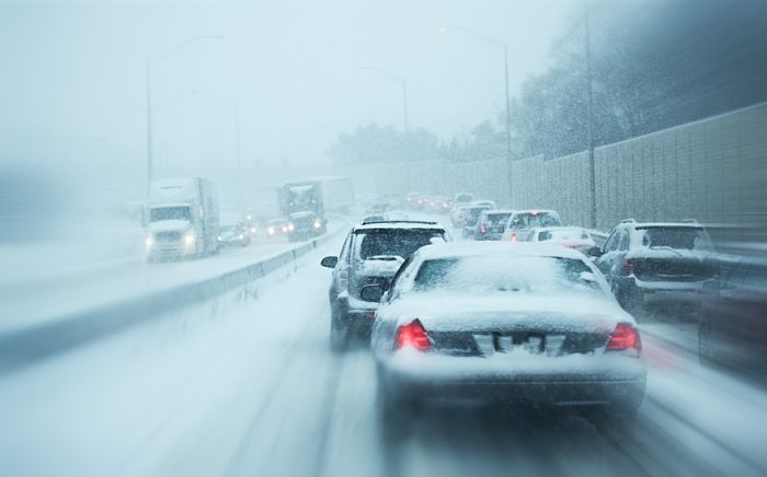 Winter Storm Traffic. I-294 Chicago Highway During Snow Storm. Heavy Snowfall and Heavy Traffic.