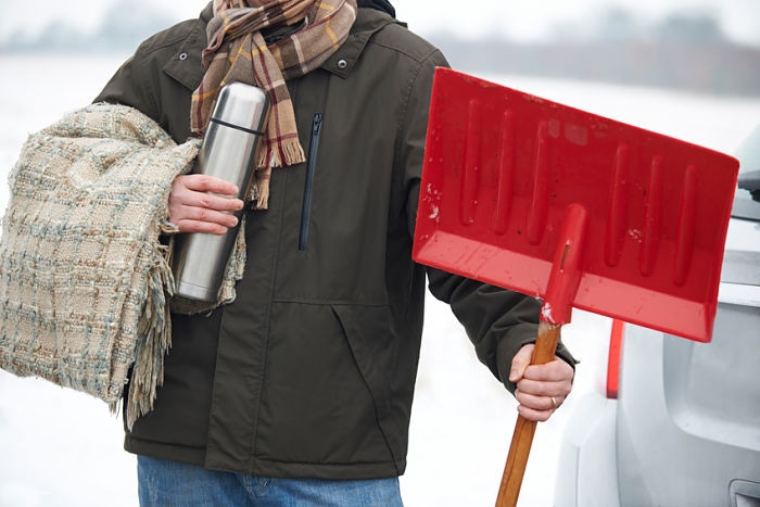 Motorist Holding Blanket And Thermos In Case Of Winter Breakdown