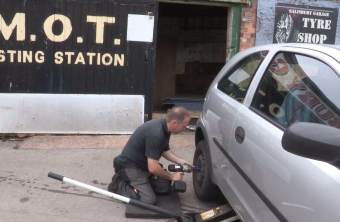 Mechanic Fixing Car
